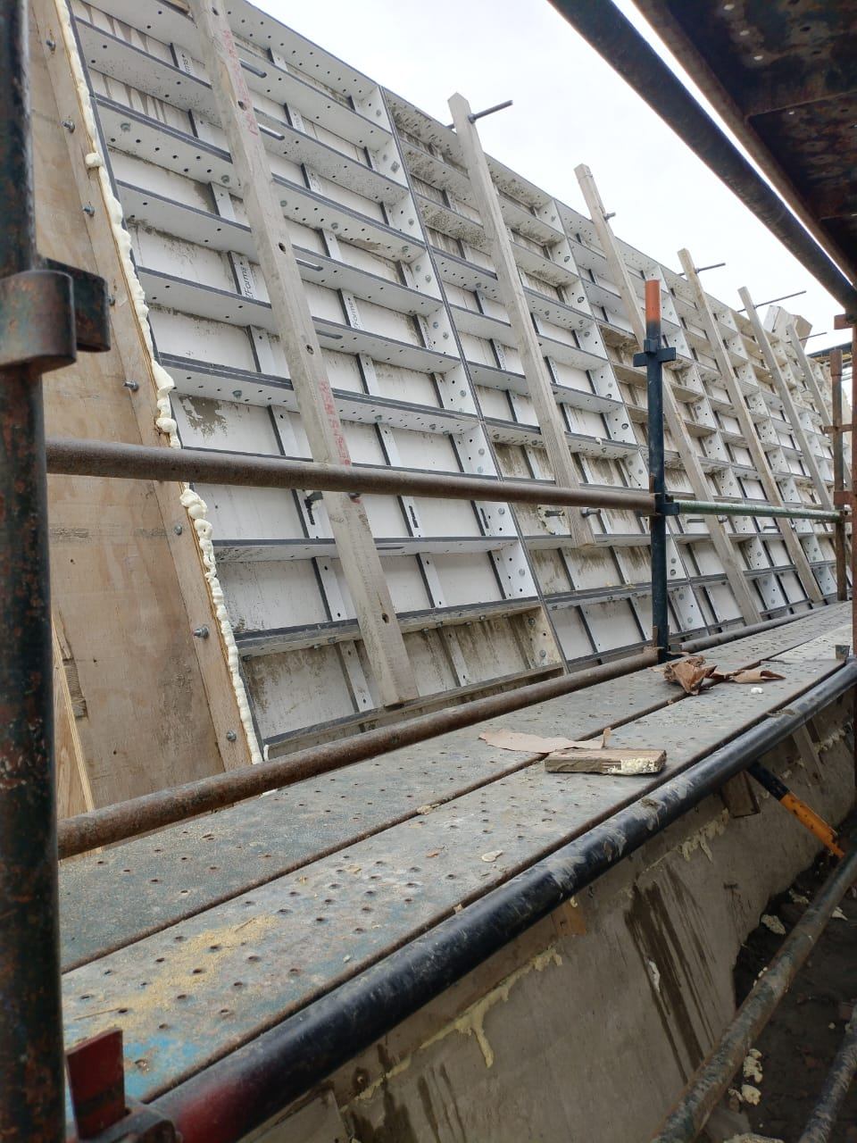 Wall formwork standing against the scaffold